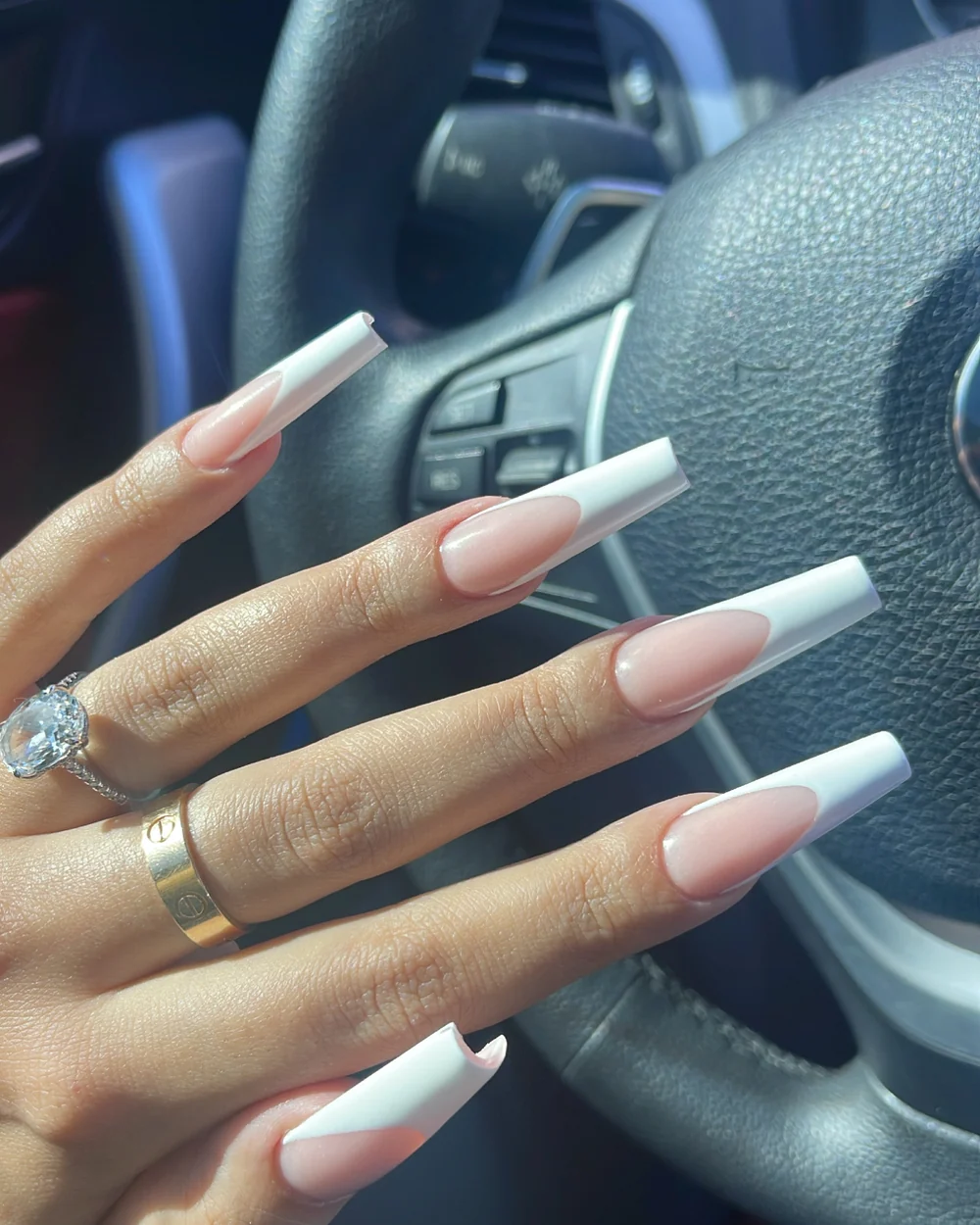 Long modern white French nail extensions