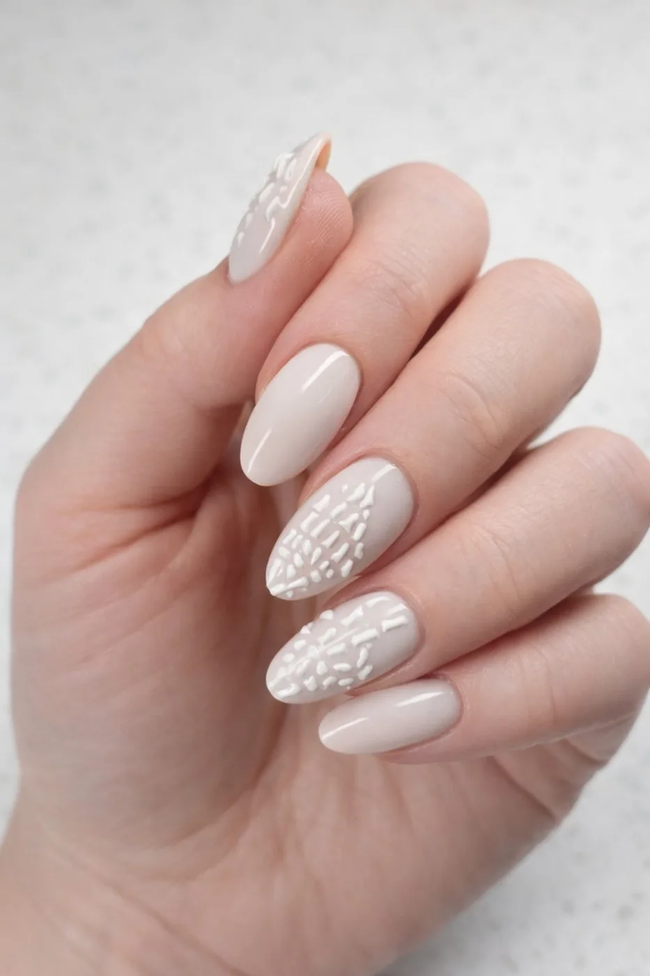 Natural ivory manicure with a soft shimmer accent